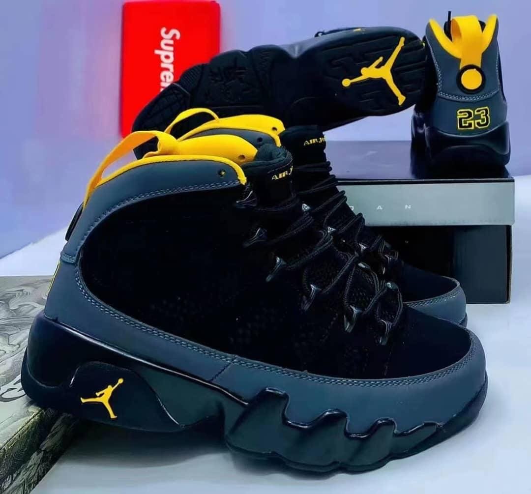 Air Jordan 9 Retro in the Dark Charcoal/University Gold colorway.