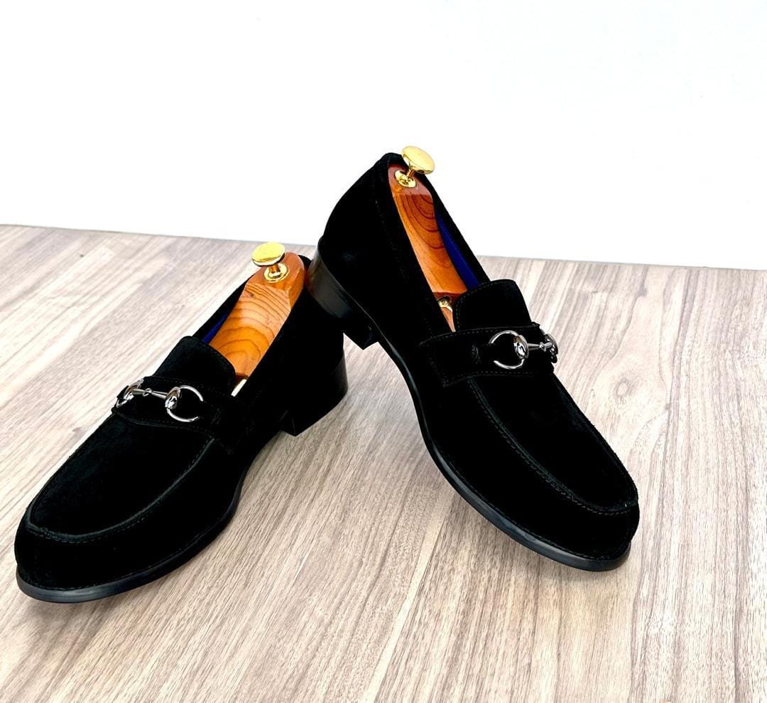 black suede loafers with silver-toned horse-bit hardware