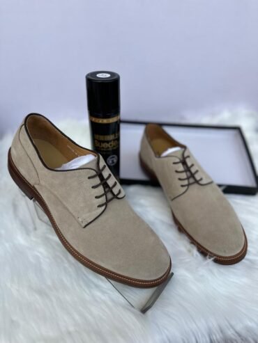 Brunello Cucinelli men’s suede derby shoes in a taupe color