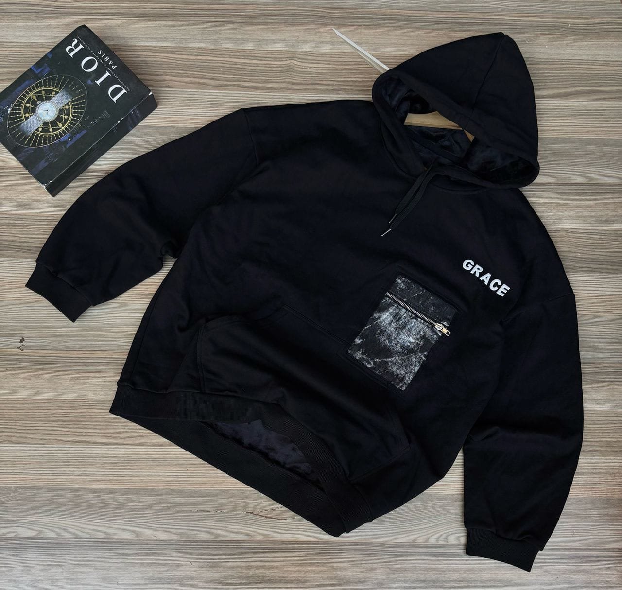 black hoodie with a kangaroo pocket