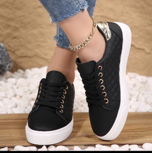 pair of black, quilted-design sneakers