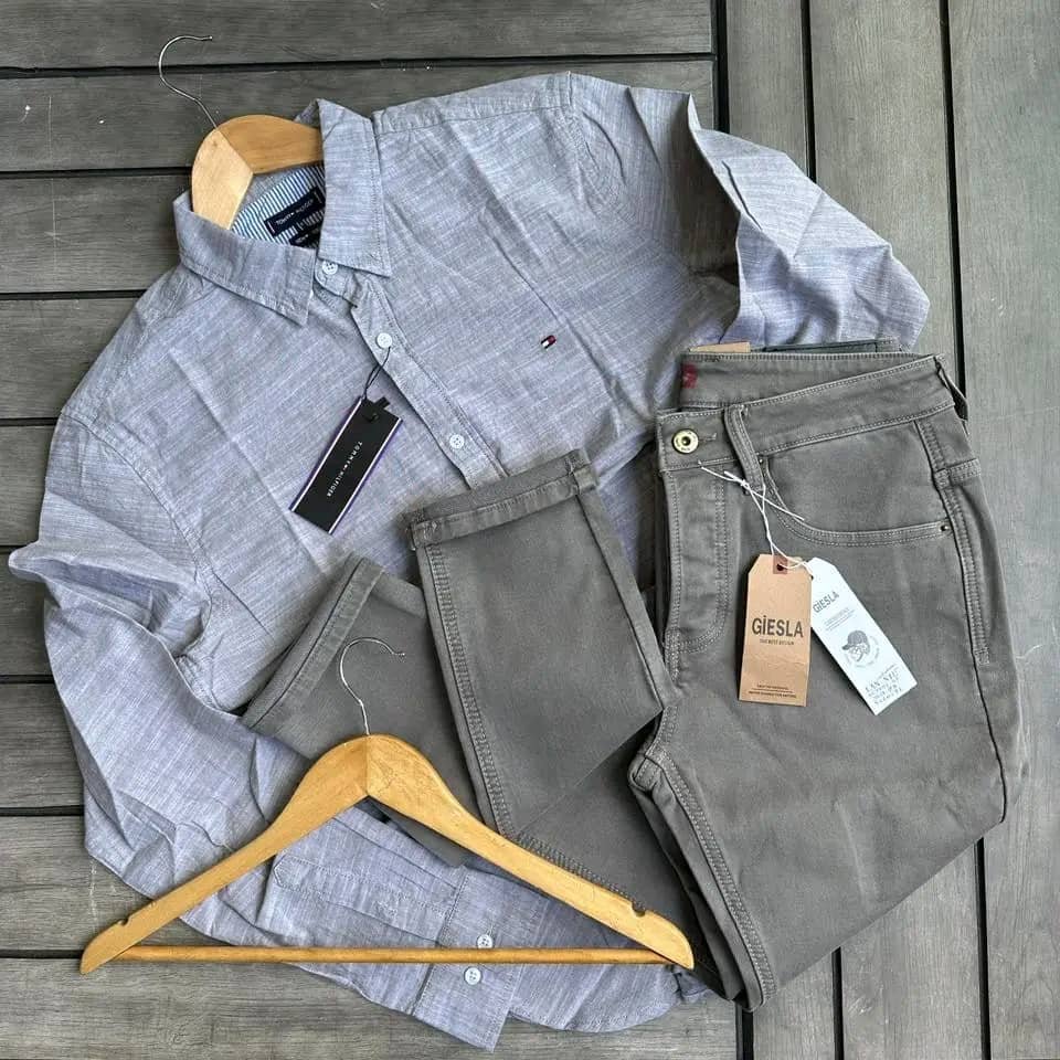 light gray long-sleeve button-down shirt and a pair of dark gray pants