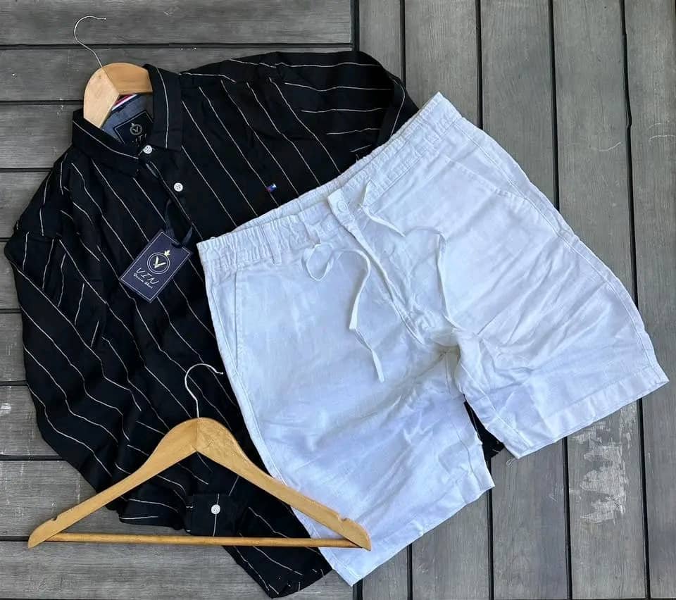black and white striped long-sleeve shirt and a pair of white linen shorts