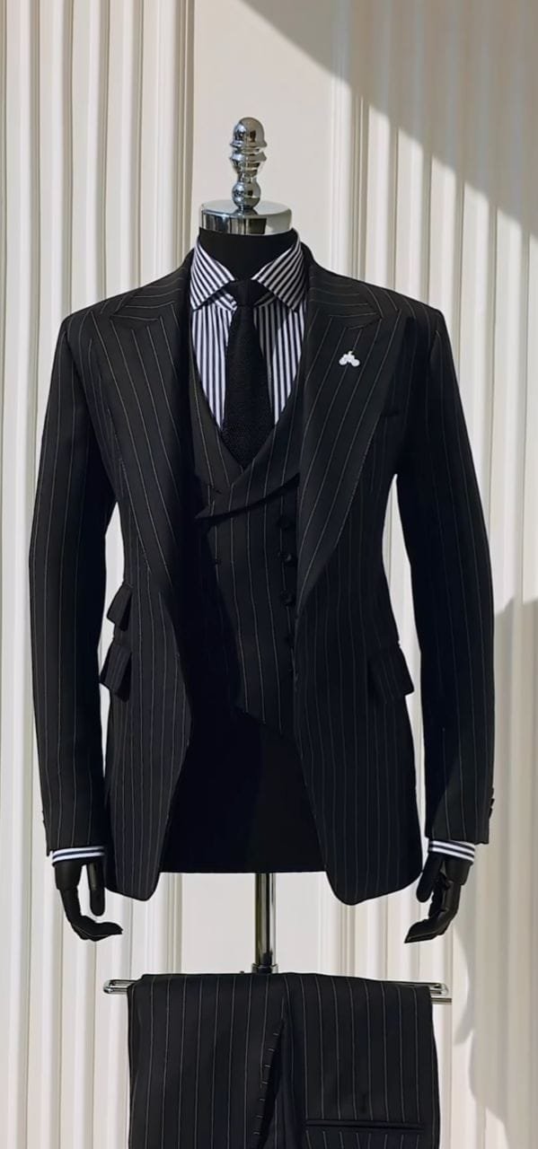 black pinstripe three-piece suit