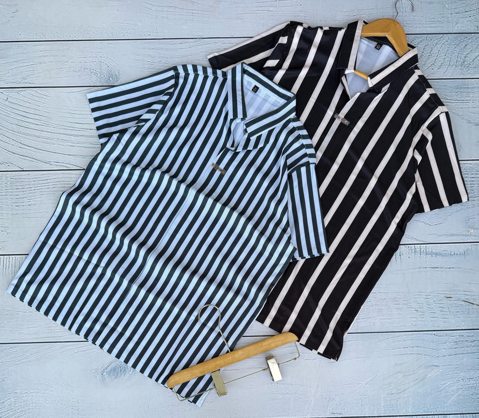 two short-sleeved, collared shirts