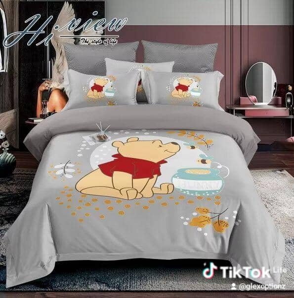 bedsheet set features a Winnie-the-Pooh theme,