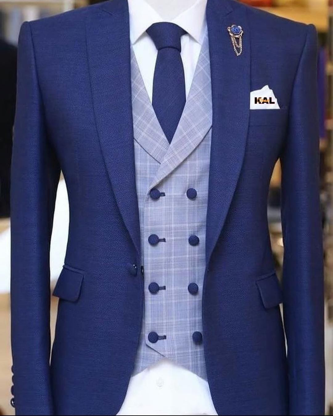 well-tailored three-piece suit