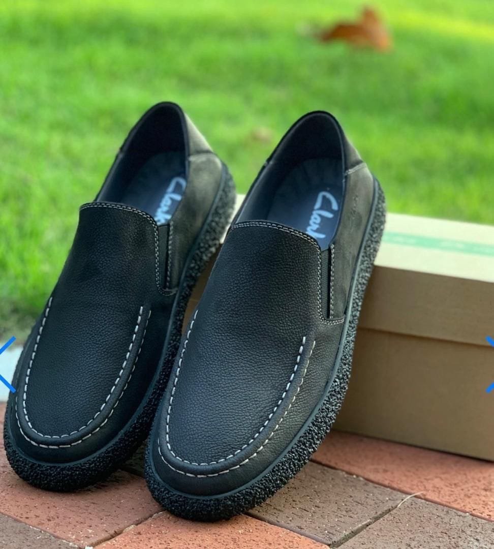 black leather Clark slip-on shoes