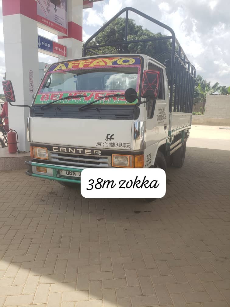 white Mitsubishi Fuso Canter light-duty truck