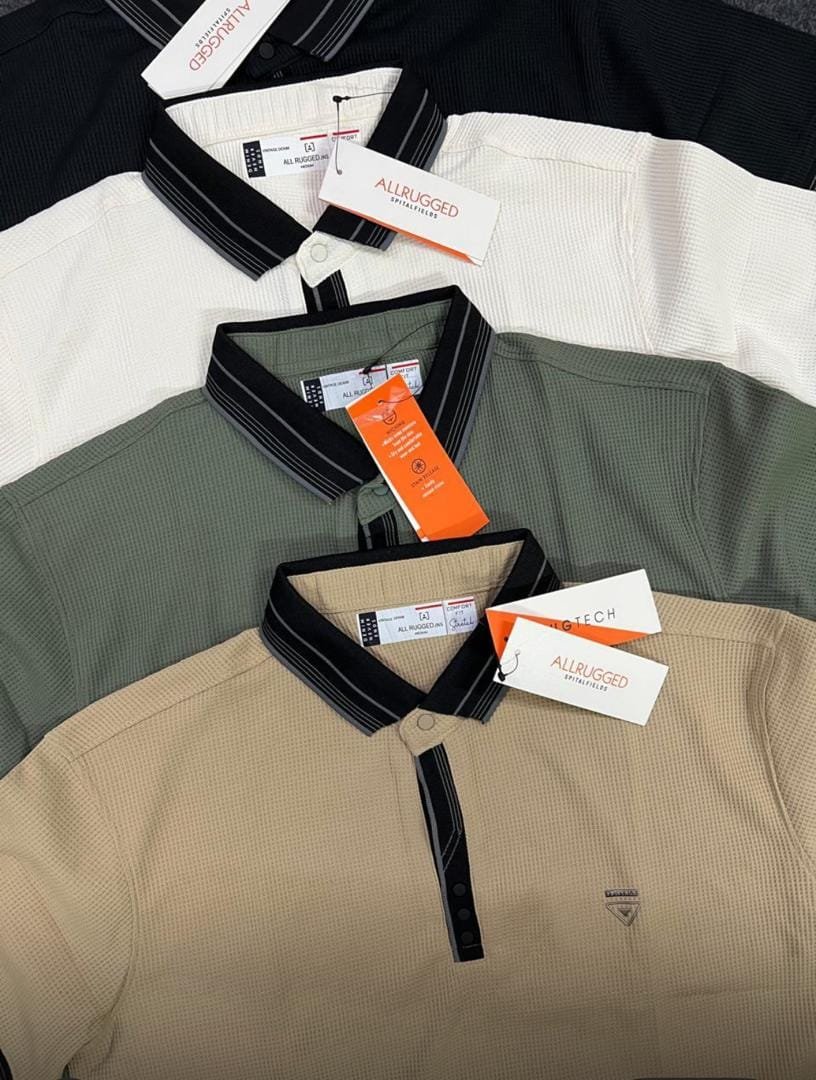 stack of four long-sleeved polo shirts