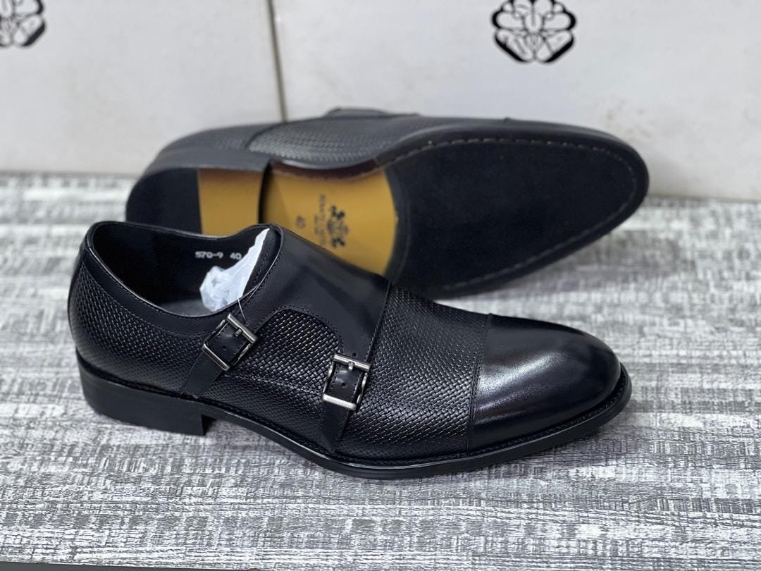 black leather double monk strap shoes.