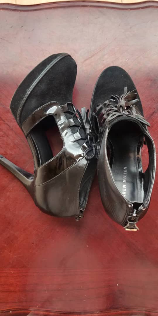black women’s high-heeled shoes.