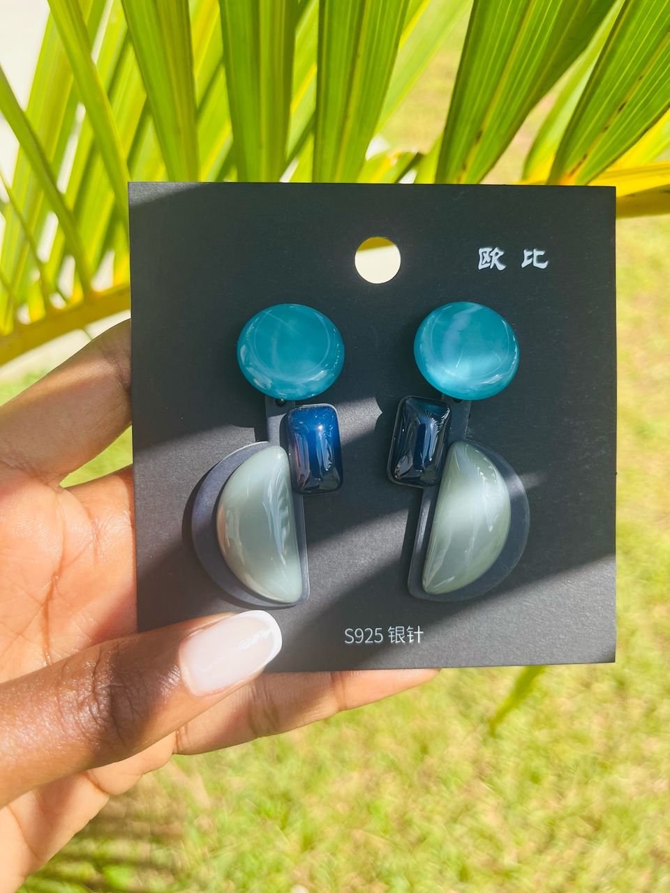 pair of pink, petal-shaped dangle earrings.