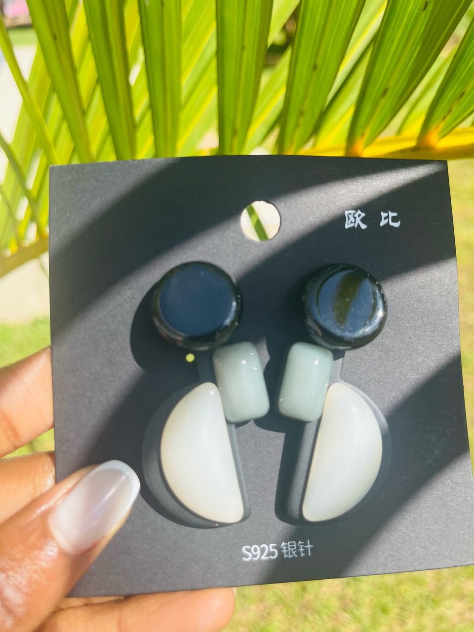 pair of pink, petal-shaped dangle earrings.