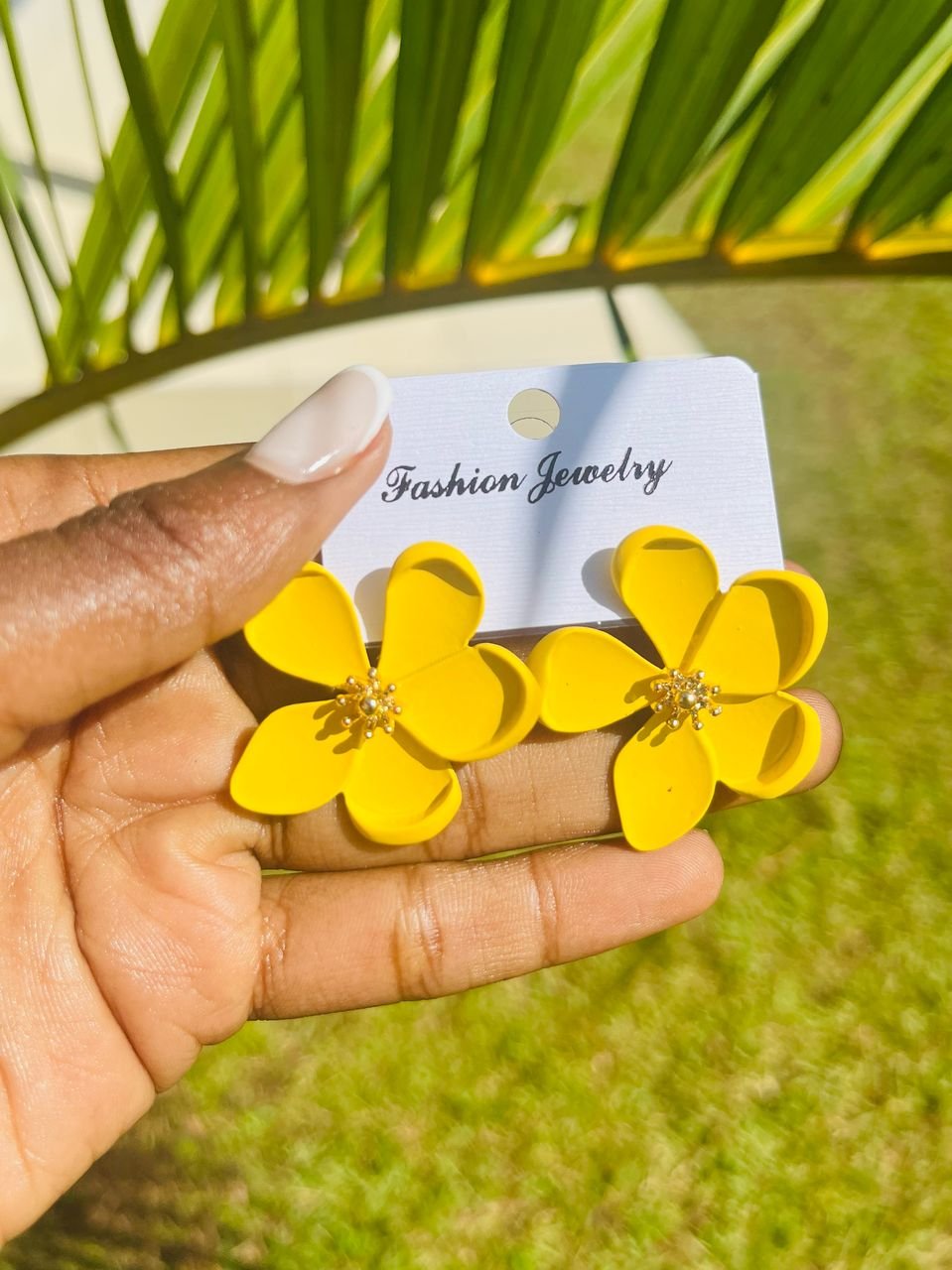 pair of yellow flower-shaped stud earrings,