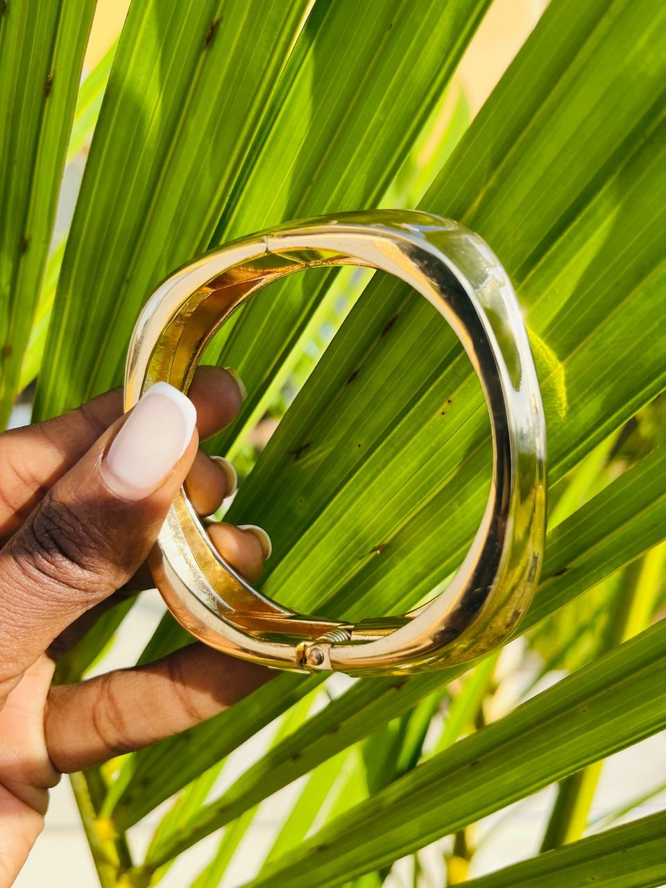 shiny, gold-toned bangle