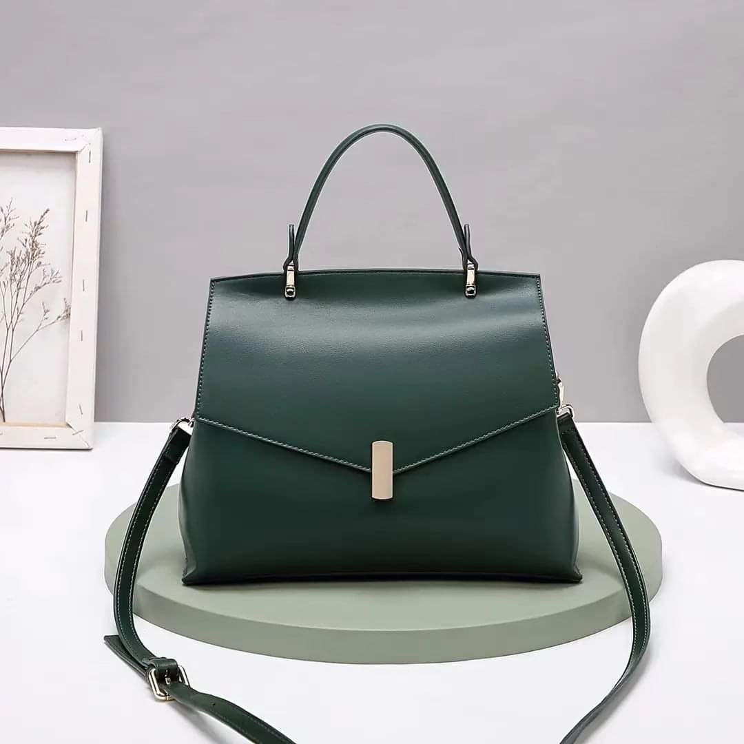 green leather handbag