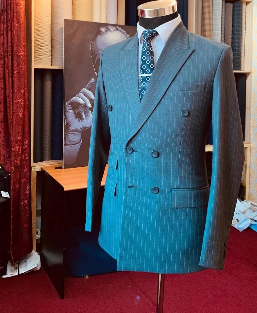 double-breasted suit with a grey, pinstripe pattern.
