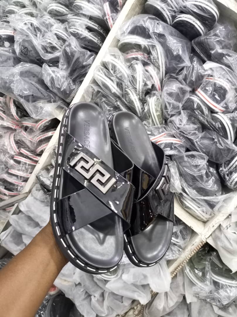 Versace women’s black leather sandals