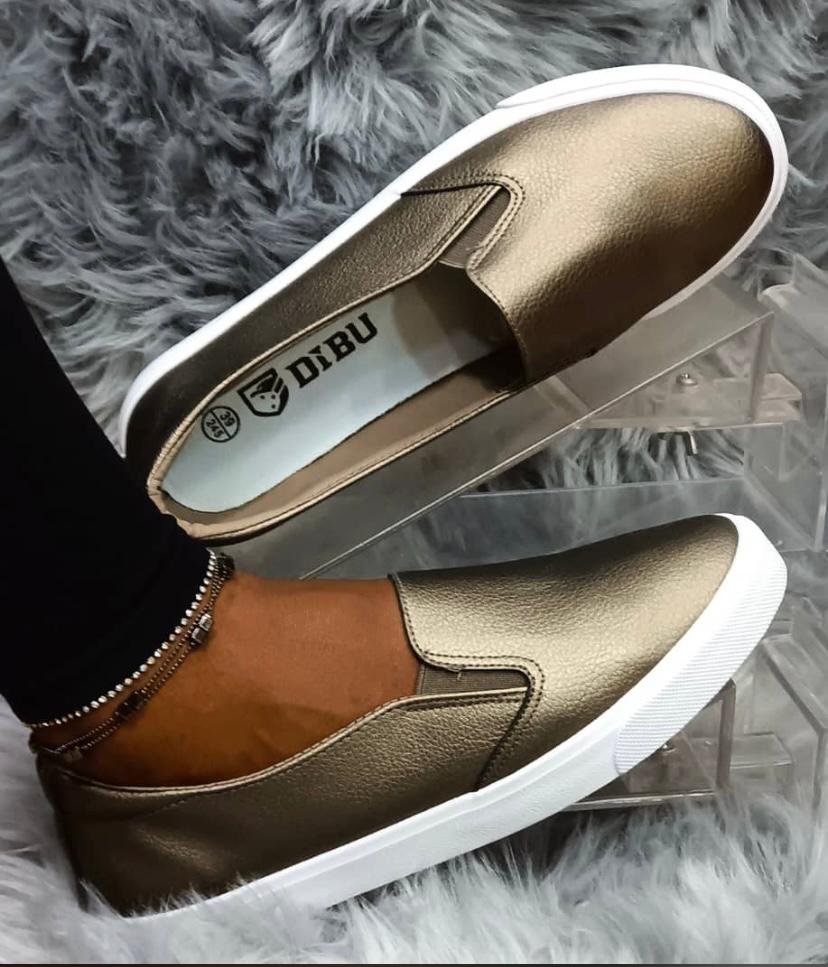 bronze-colored slip-on shoes with a white sole