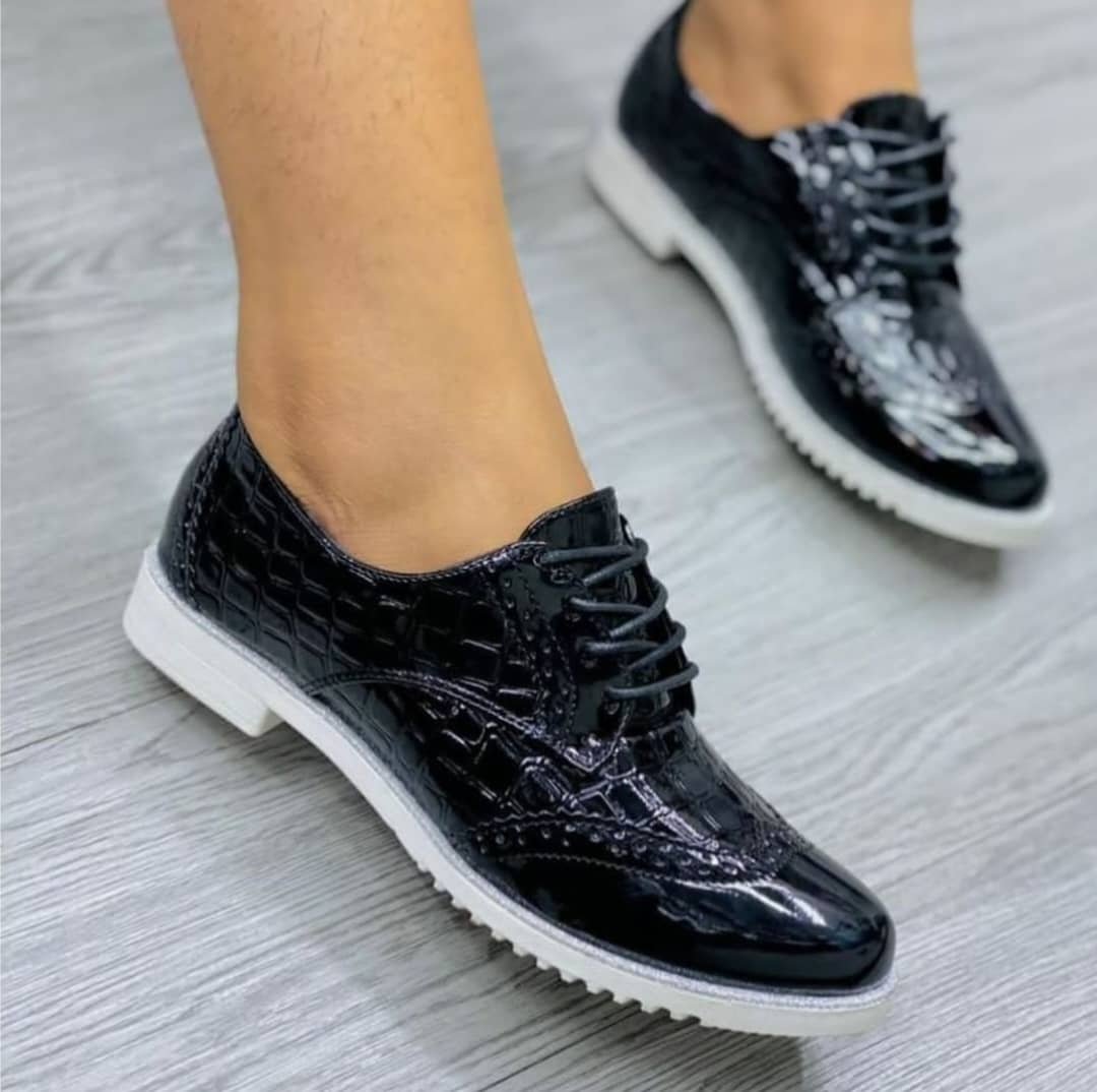 black, patent leather brogue