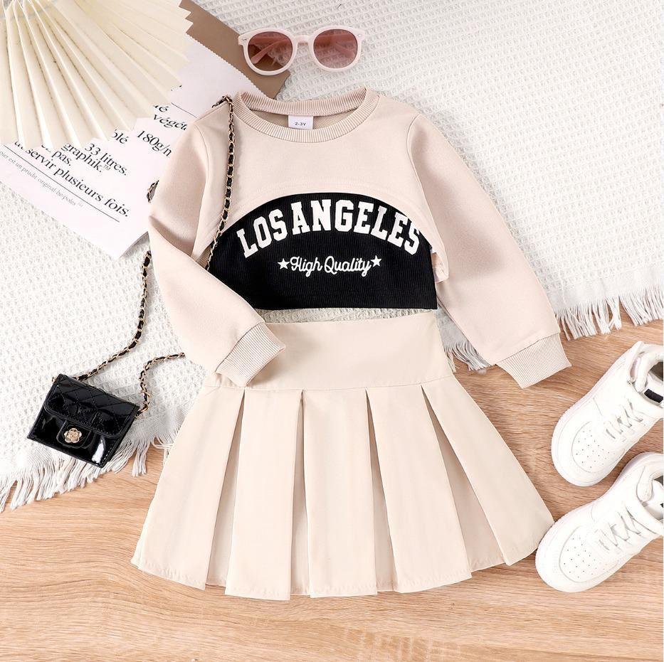 A long-sleeve top and a pleated skirt.