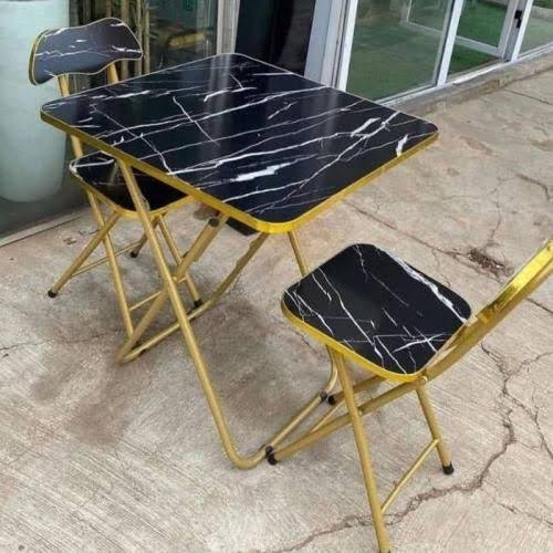 black marble-patterned top and gold-colored legs