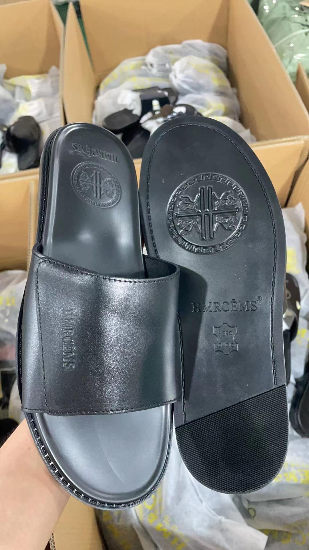 HERCÊMS” branded sandals,