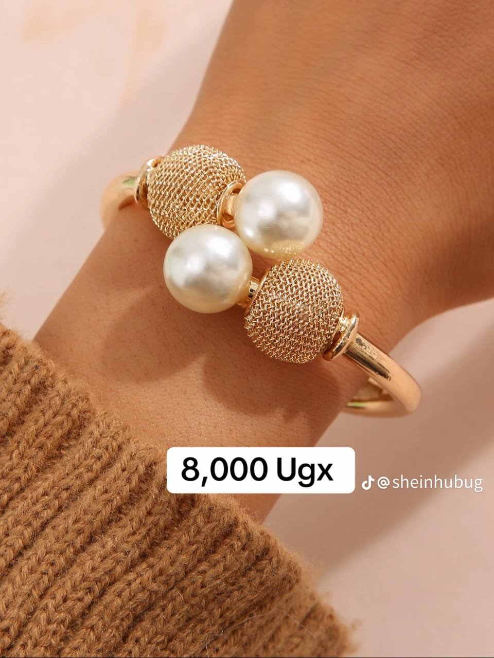 gold-colored alloy band