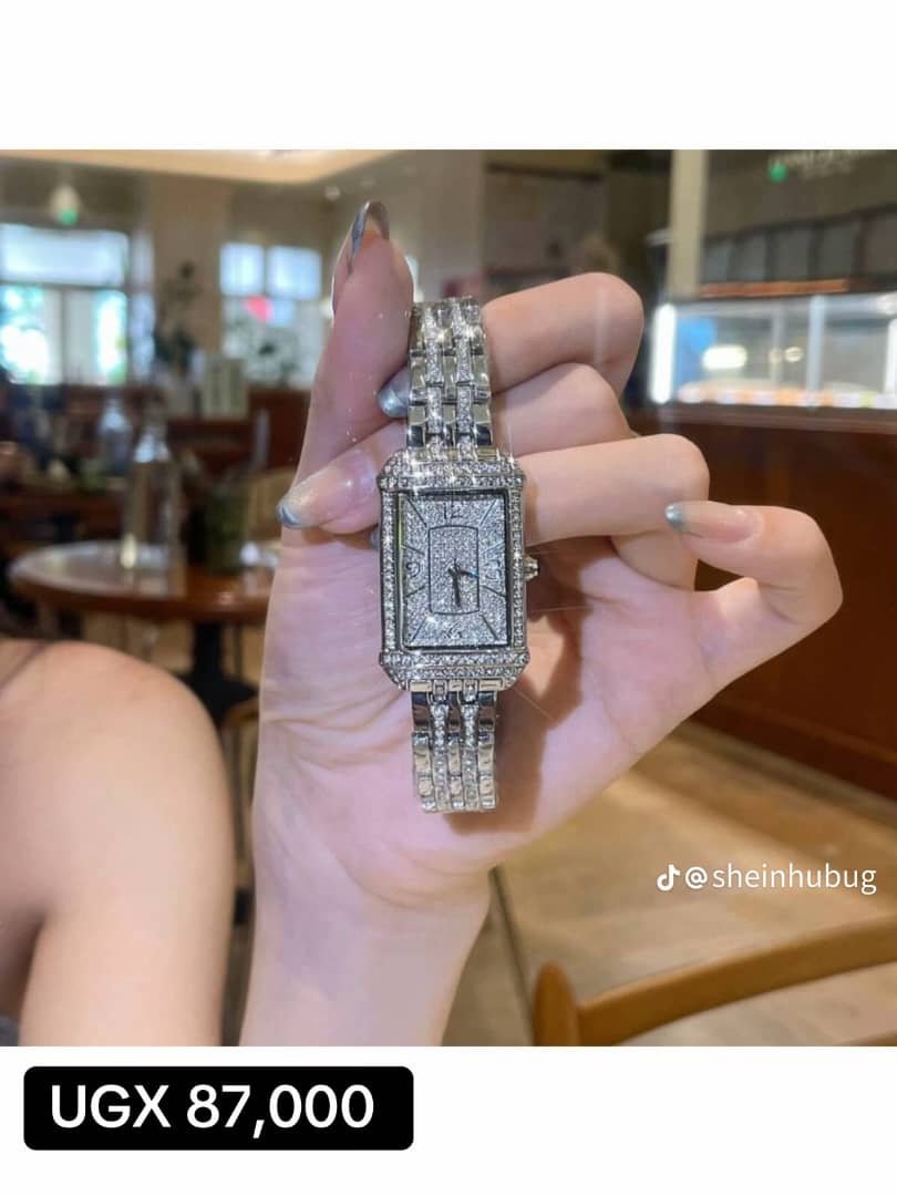 rectangular, silver-toned timepiece