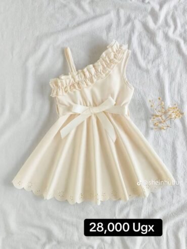 cream-colored, one-shoulder dress
