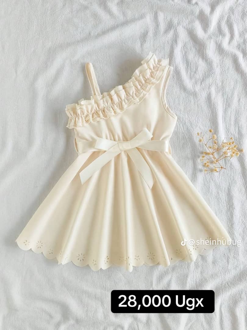 cream-colored, one-shoulder dress